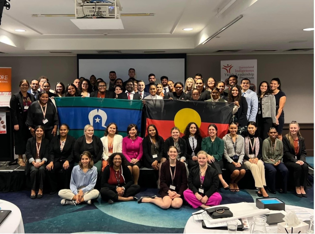 Participants of the QLD Indigenous Youth Leadership Program with Quandamooka woman and QLD Minister for Communities and Housing The Hon. Leeanne Enoch MP.