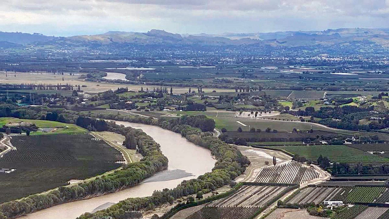 An aerial view of the lands around the Tutaekuri River (foreground) in the days following Cyclone Gabrielle.